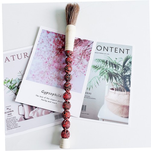 long slim carved calligraphy brush